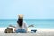 Lifestyle freelance woman relax and sitting meditation on the beach.Â 
